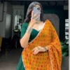 Graceful Dark Green Chinon & Georgette Navratri Lehenga Choli with Bandhani Dupatta for Garba