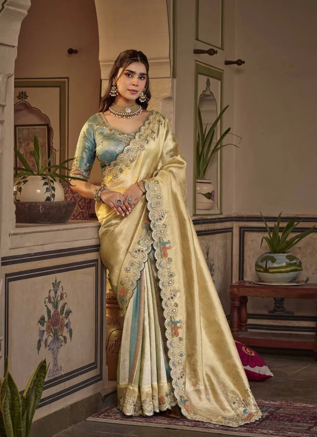 Cream Gold Silk Saree with Teal Embroidered Stitched Blouse
