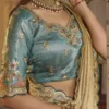 Cream Gold Silk Saree with Teal Embroidered Stitched Blouse
