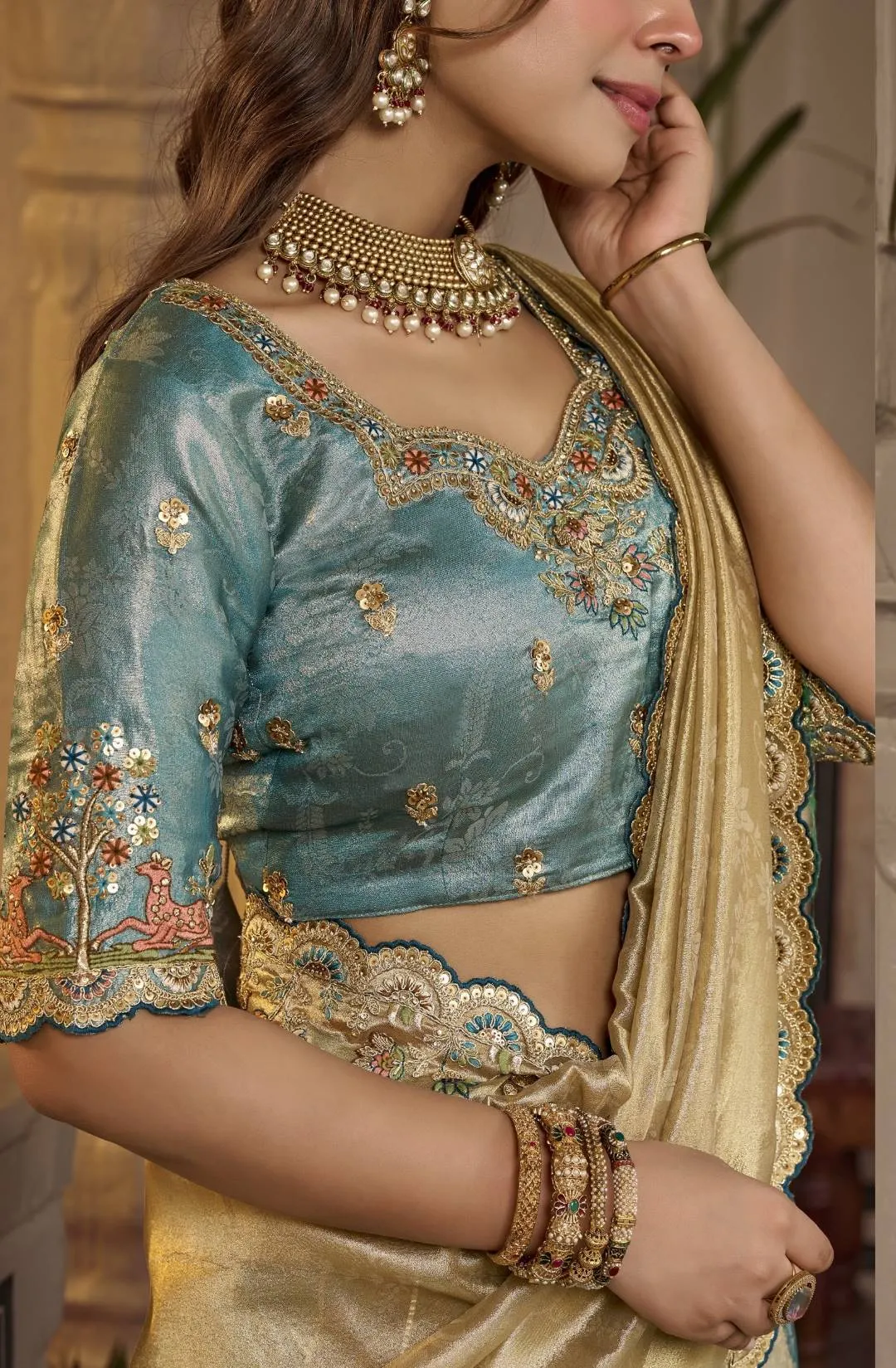 Cream Gold Silk Saree with Teal Embroidered Stitched Blouse