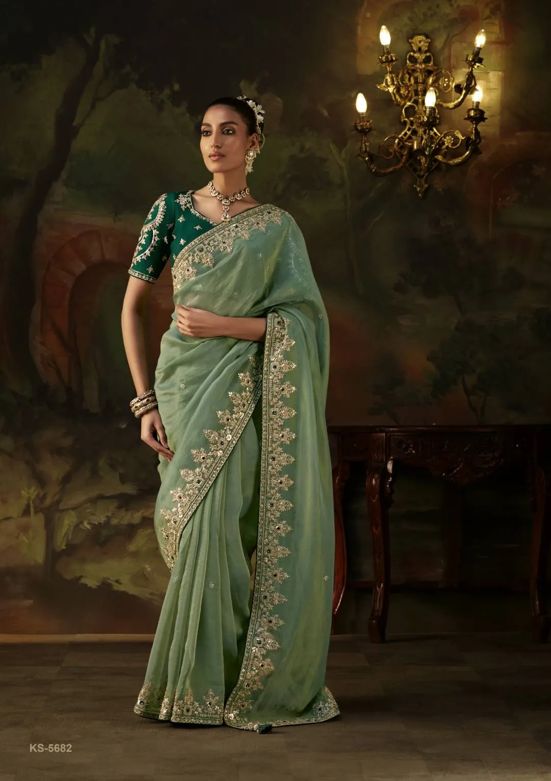 Kimora Gharana Sage Green Shimmer Silk Saree with Heavy Gold Embroidery Border and Deep Emerald Green Embroidered Blouse Piece | Luxury Wedding & Festive Wear