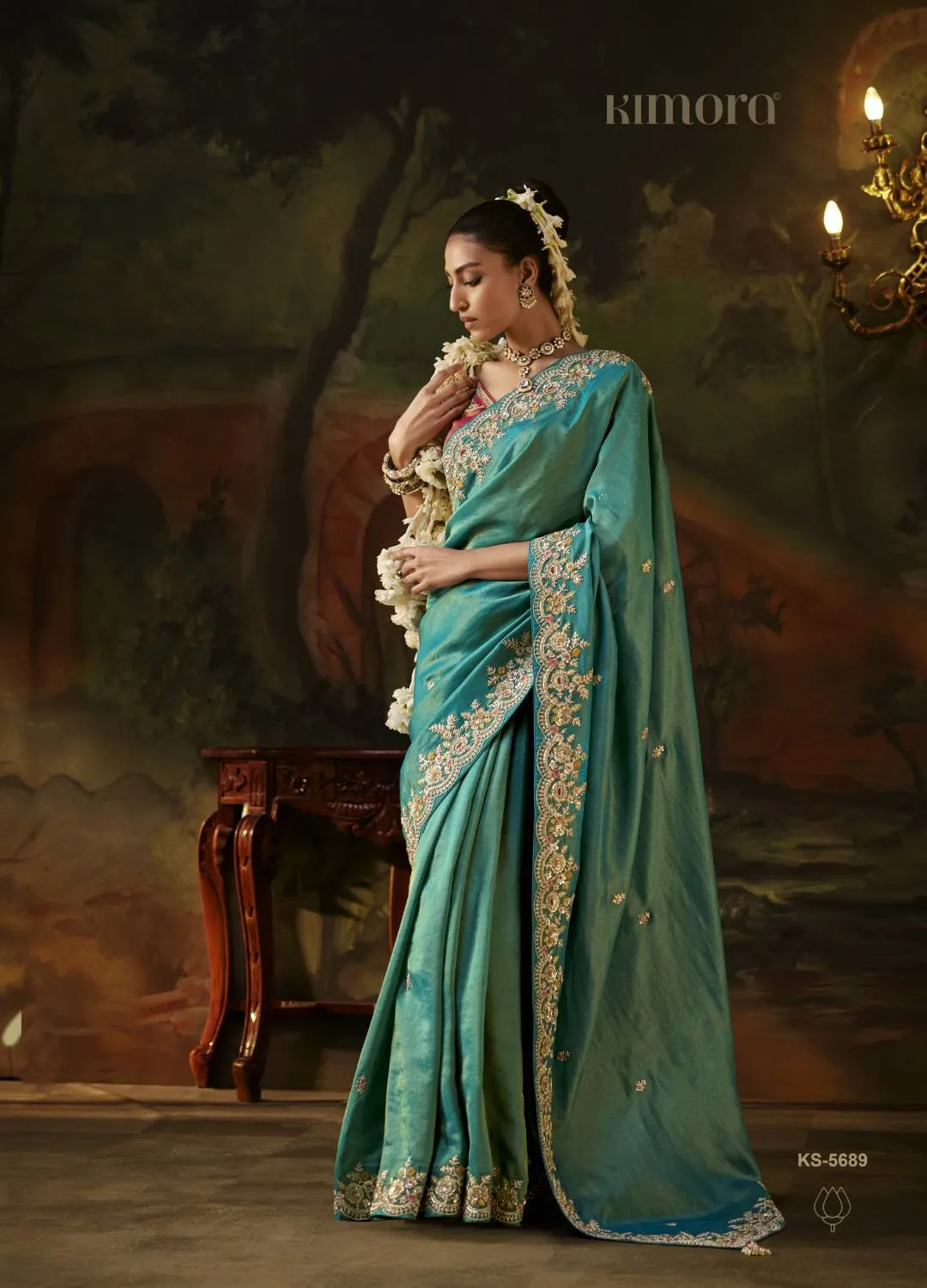 Kimora Gharana Viscose Zari Tissue Saree in Teal with Heavy Embroidered Pink Blouse