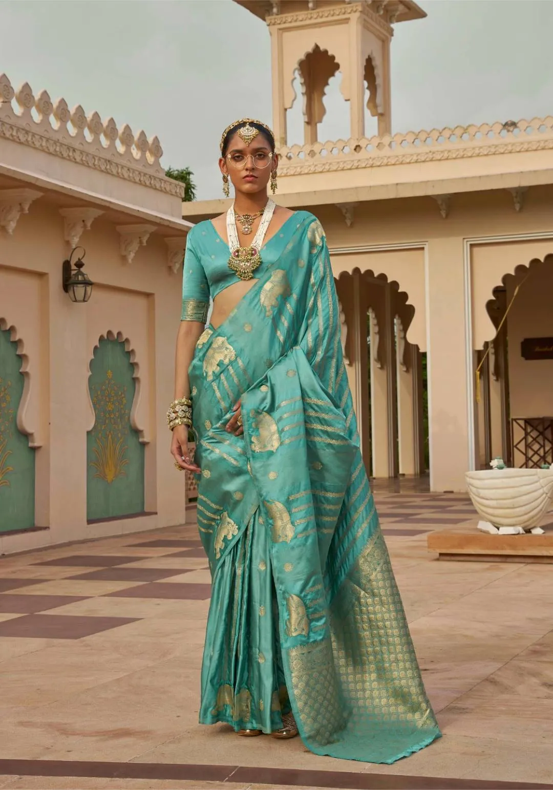Sabyasachi Turquoise Silk Saree with Heritage Golden Elephant Motifs & Zari Pallu