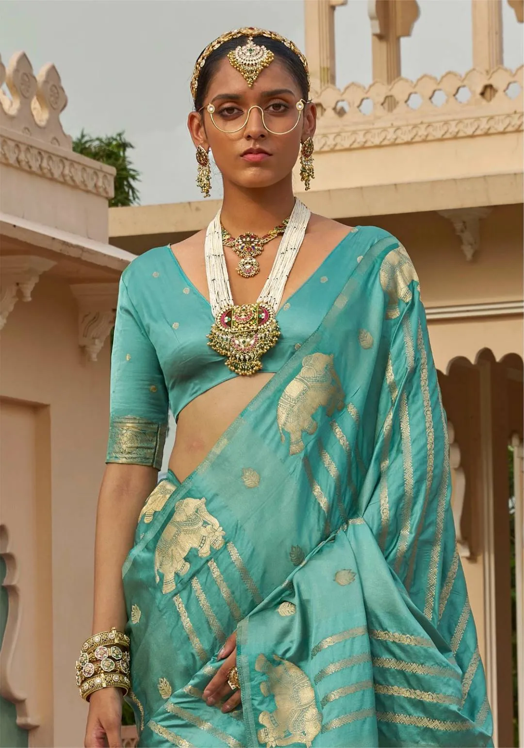 Sabyasachi Turquoise Silk Saree with Heritage Golden Elephant Motifs & Zari Pallu