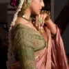 Woman's Salmon Pink Woven Viscose Tissue Silk Saree Paired With Contrast Green Blouse