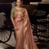 Woman's Salmon Pink Woven Viscose Tissue Silk Saree Paired With Contrast Green Blouse